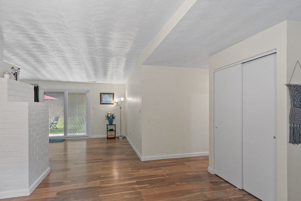 24 Algonquin Road Chelmsford, MA 01824 - Photo 6 of 38 a view of a livingroom from a hallway