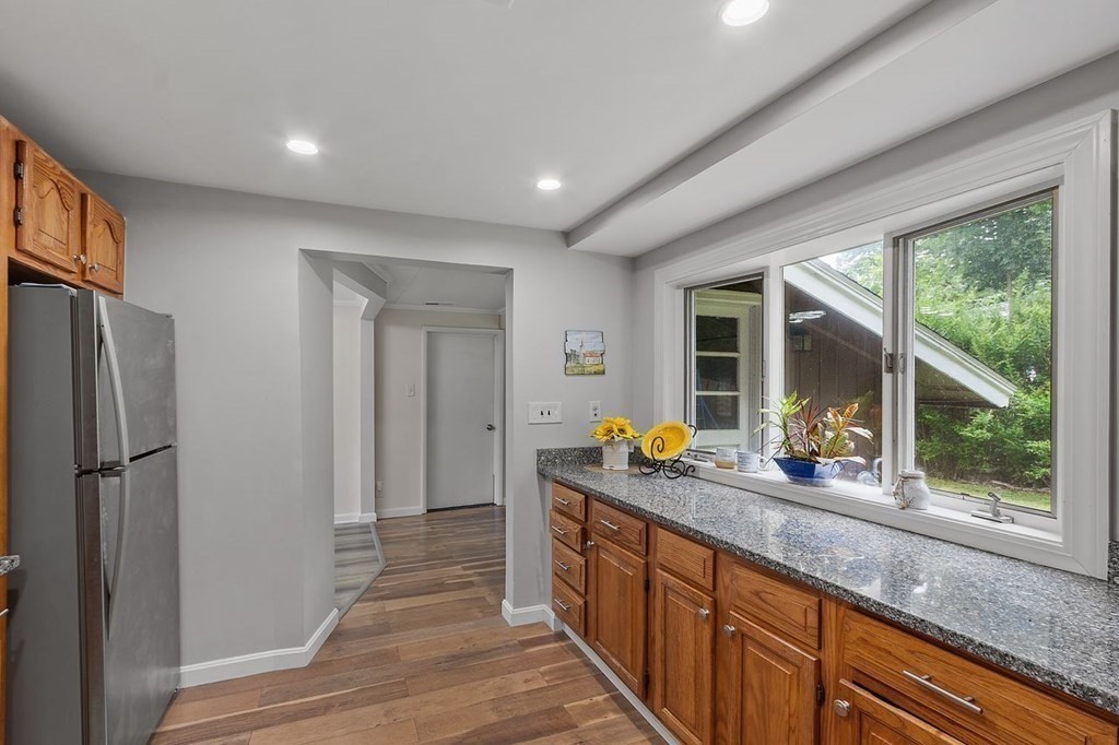 24 Algonquin Road Chelmsford, MA 01824 - Photo 10 of 38 a kitchen with stainless steel appliances granite countertop a refrigerator and a sink