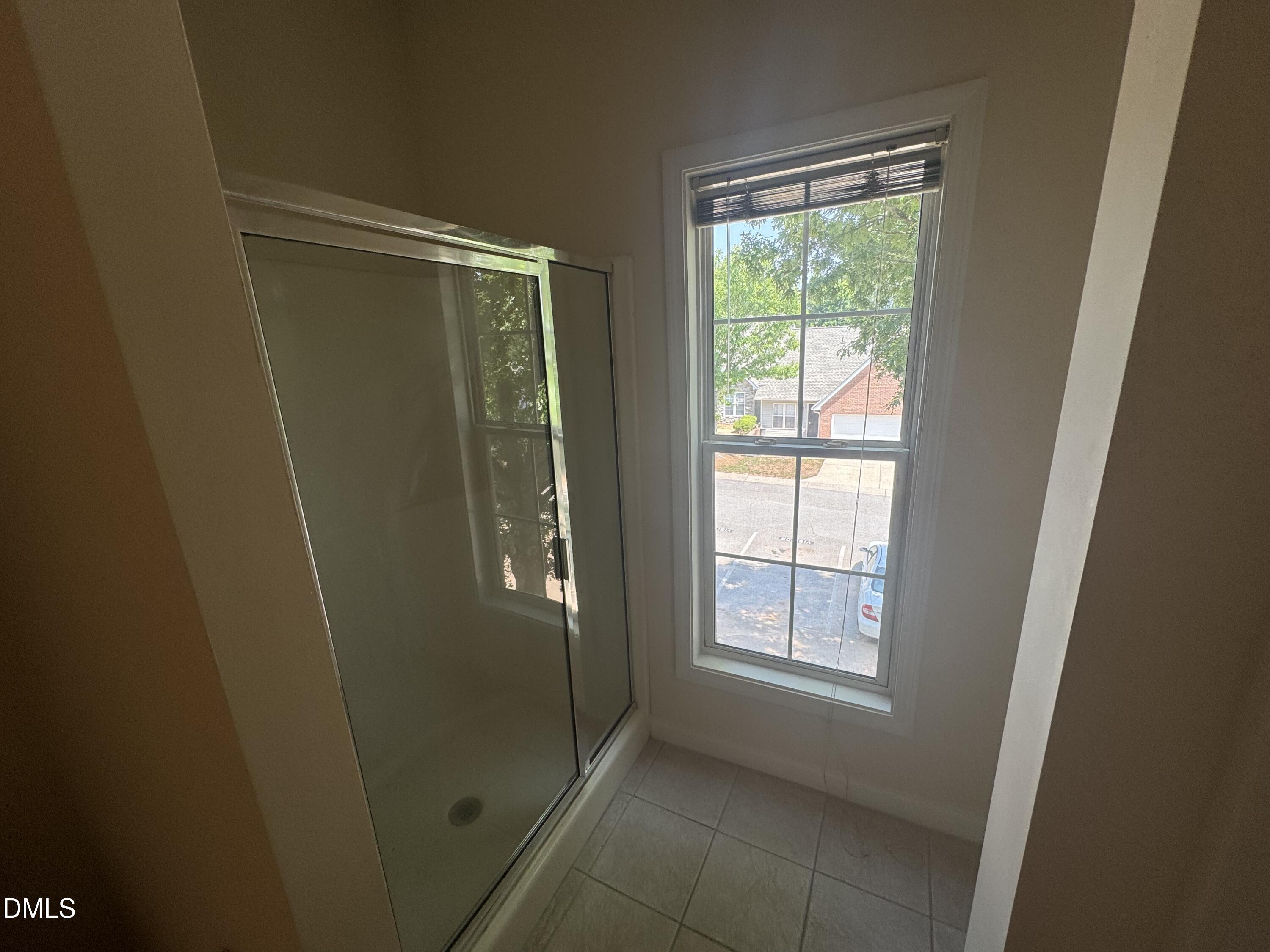 2520 Friedland Place, Unit 202 Raleigh, NC 27617 - Photo 12 of 14 a view of an empty room with a window