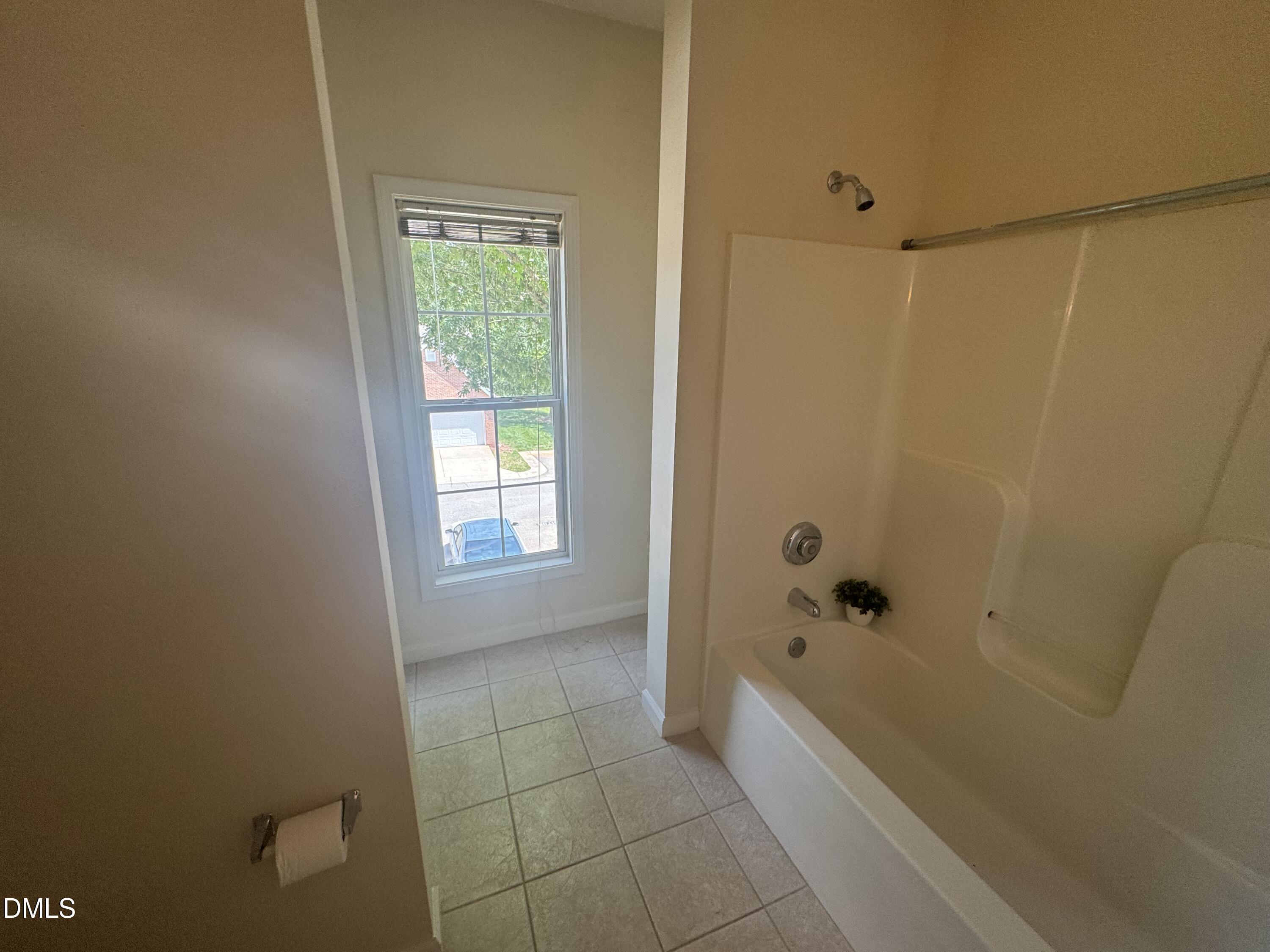 2520 Friedland Place, Unit 202 Raleigh, NC 27617 - Photo 13 of 14 a bathroom with a bathtub and shower