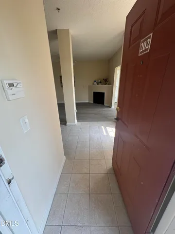 a view of a hallway to rooms