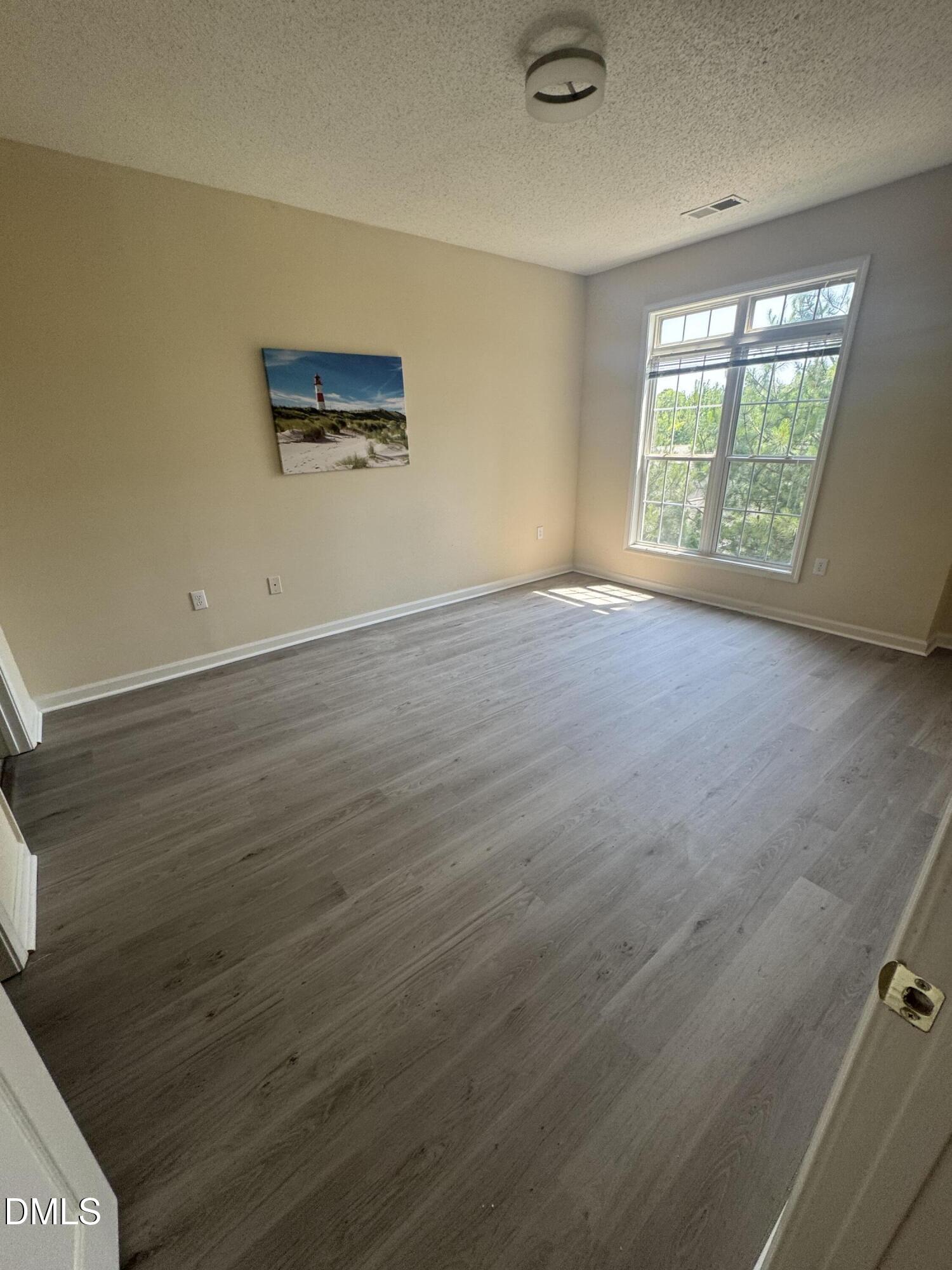 2520 Friedland Place, Unit 202 Raleigh, NC 27617 - Photo 10 of 14 an empty room with windows