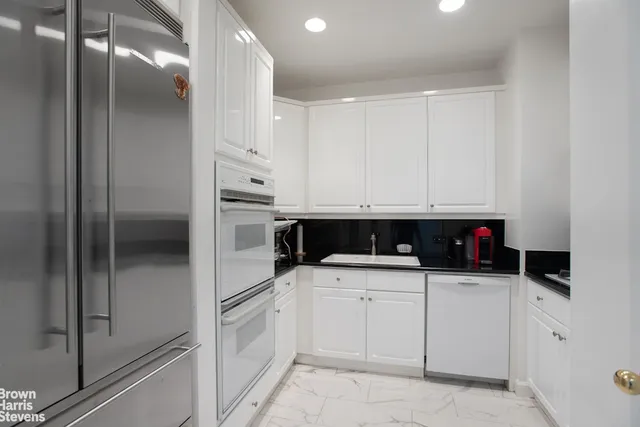 a bedroom with a bed and flat screen tv
