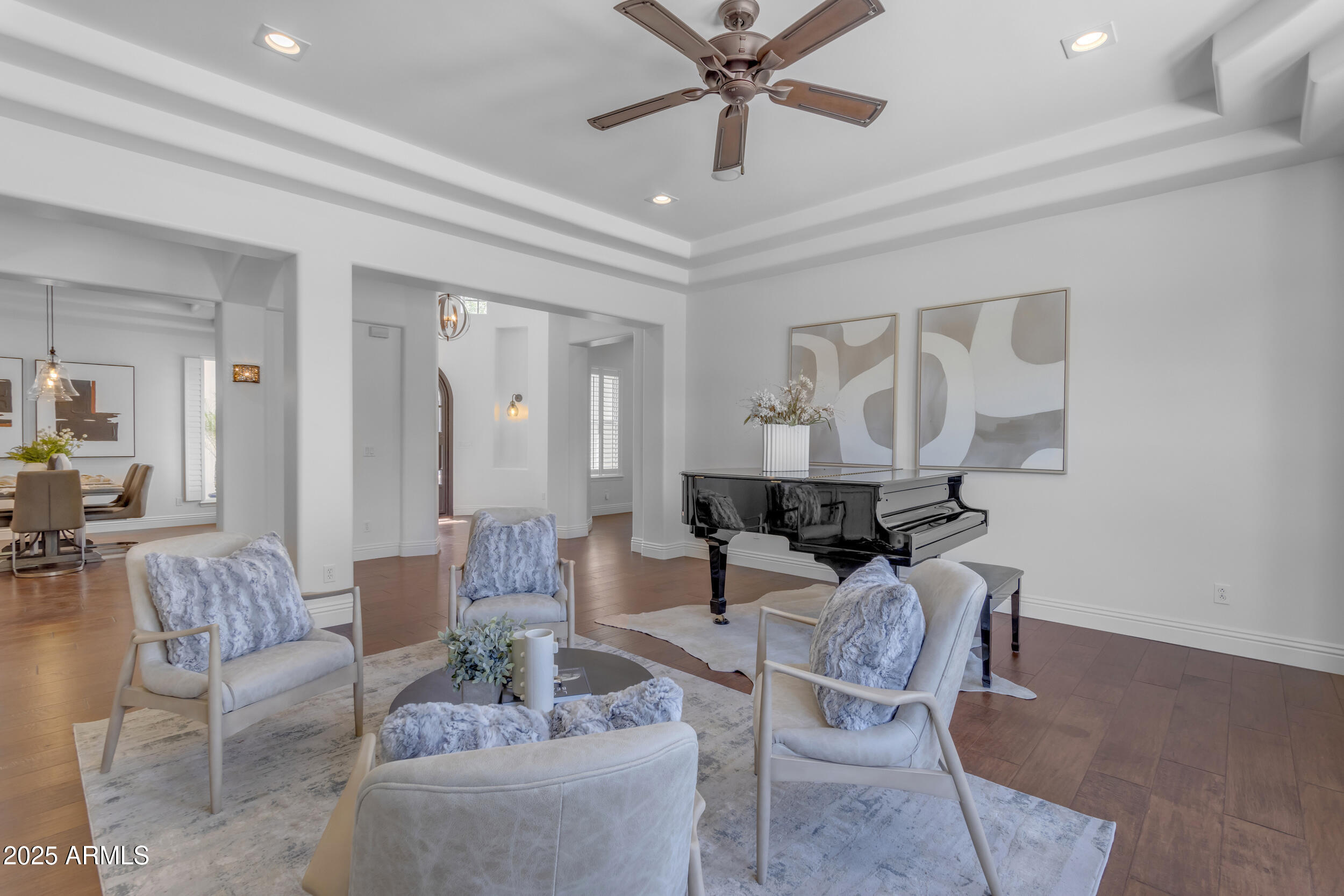 2820 Page Court Gilbert, AZ 85234 - Photo 20 of 109 a living room with furniture and a chandelier