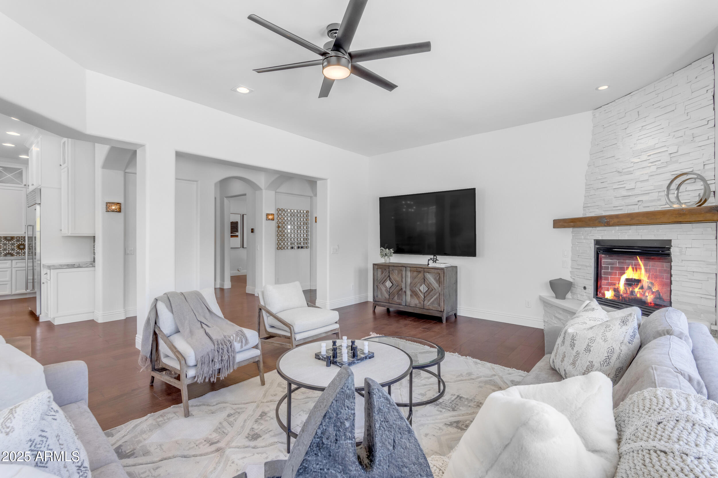 2820 Page Court Gilbert, AZ 85234 - Photo 26 of 109 a living room with furniture and a flat screen tv