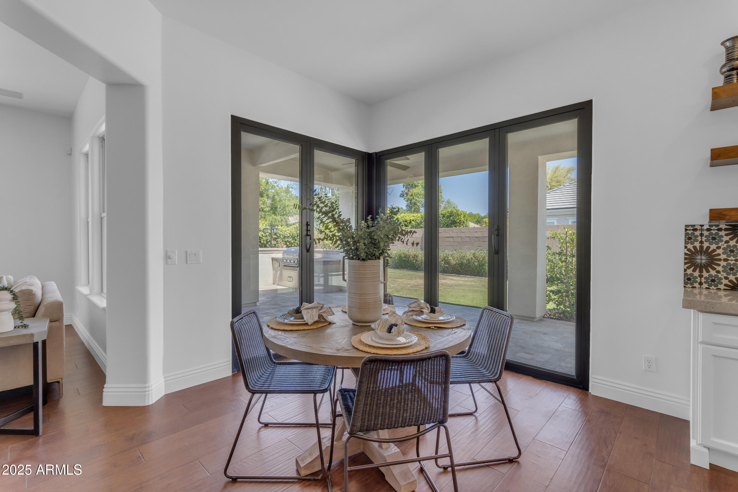 2820 Page Court Gilbert, AZ 85234 - Photo 29 of 109 a view of a dining room with furniture window and wooden floor