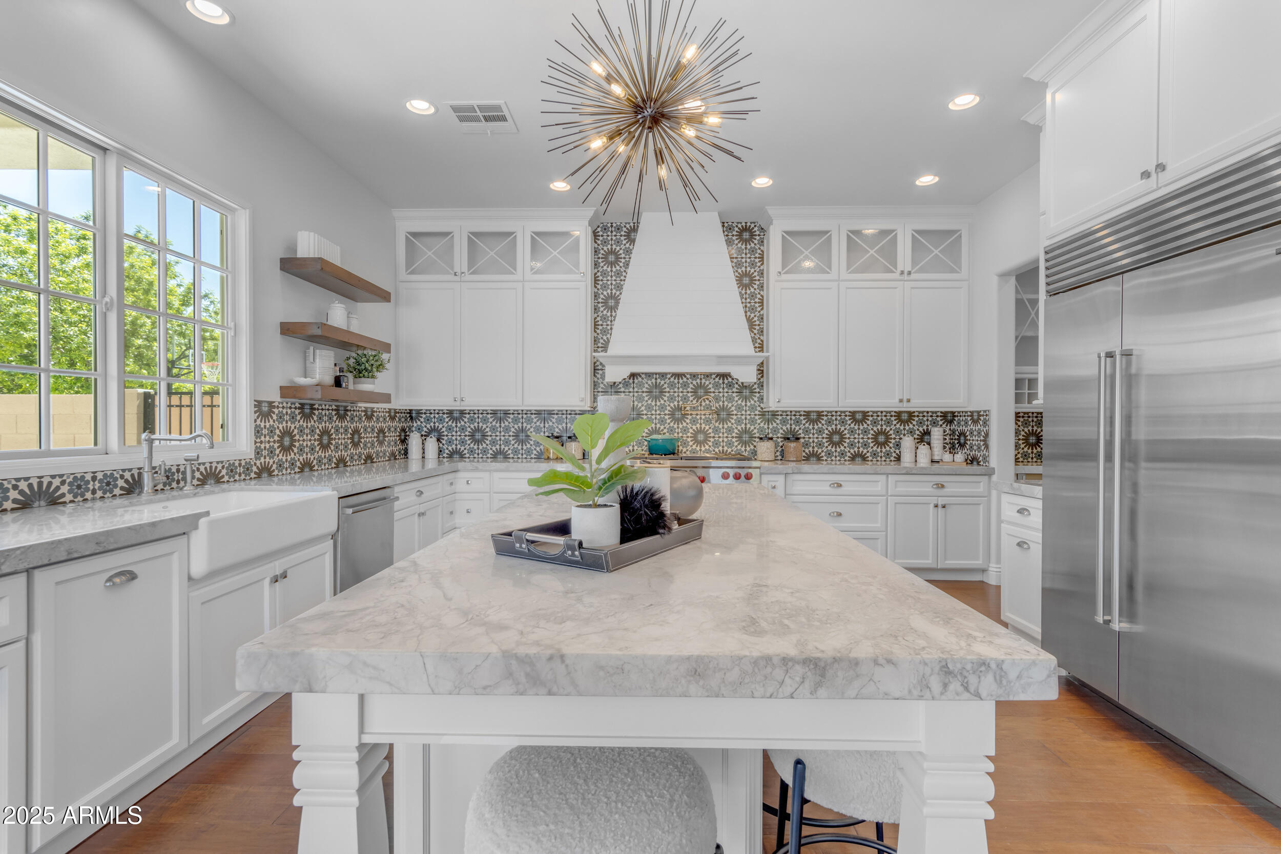 2820 Page Court Gilbert, AZ 85234 - Photo 31 of 109 a kitchen with stainless steel appliances granite countertop a sink window and cabinets