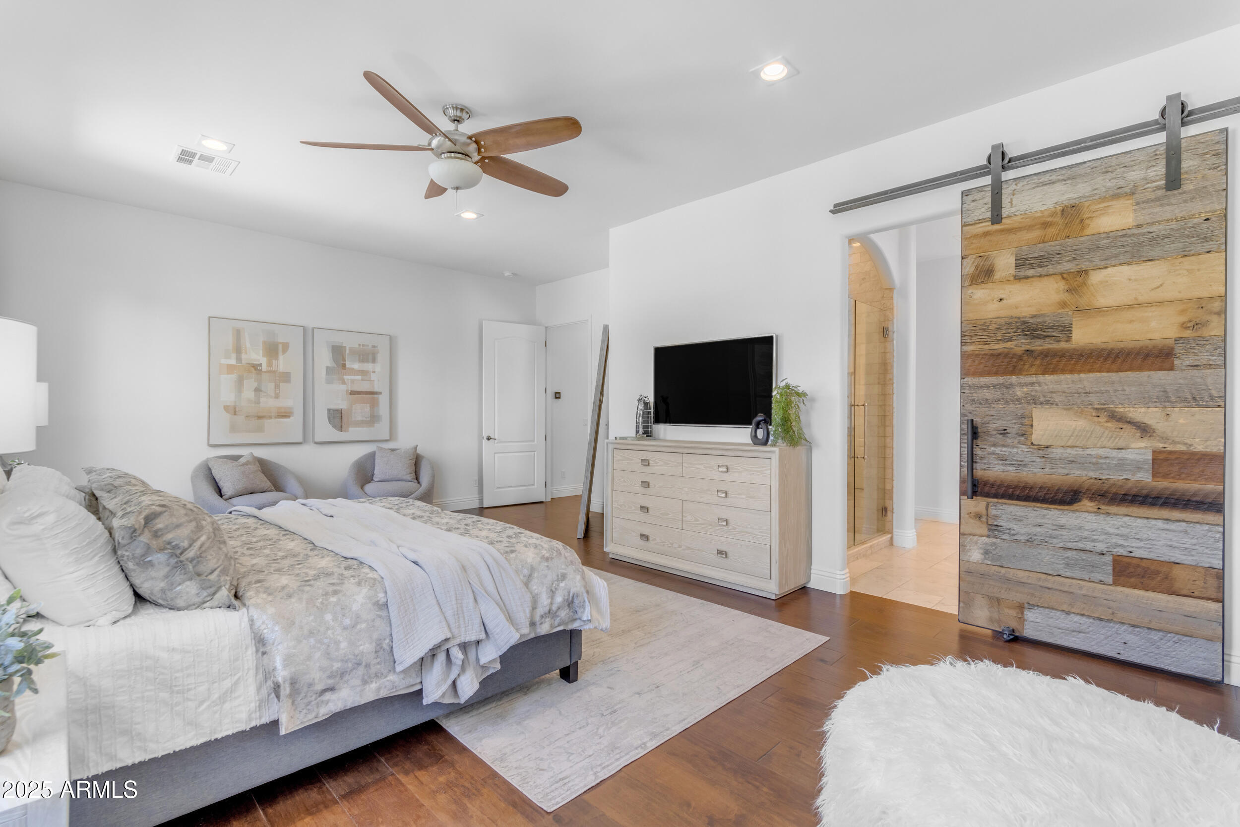 2820 Page Court Gilbert, AZ 85234 - Photo 44 of 109 a bedroom with a bed and a flat screen tv