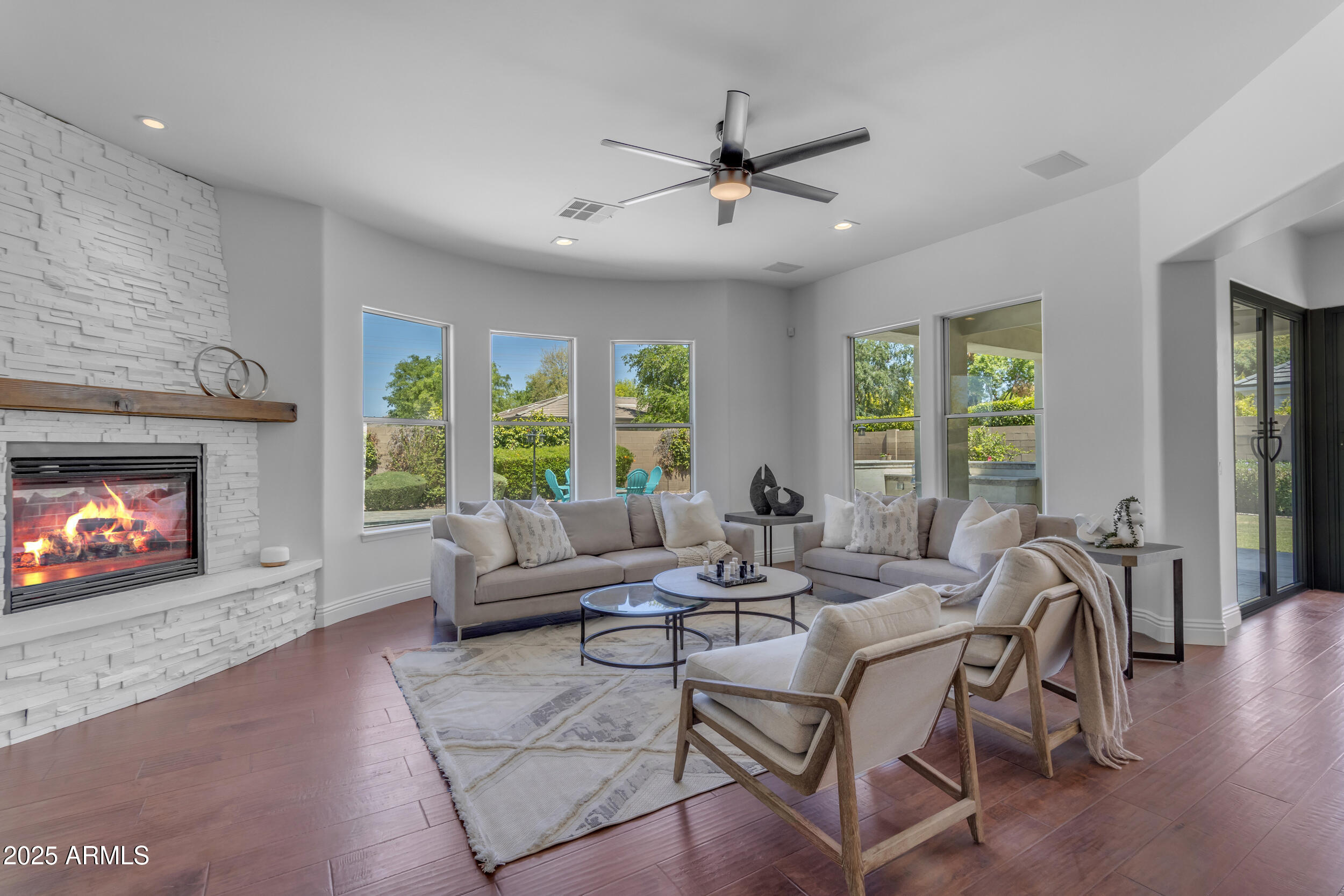 2820 Page Court Gilbert, AZ 85234 - Photo 3 of 109 a living room with furniture a fireplace and a large window