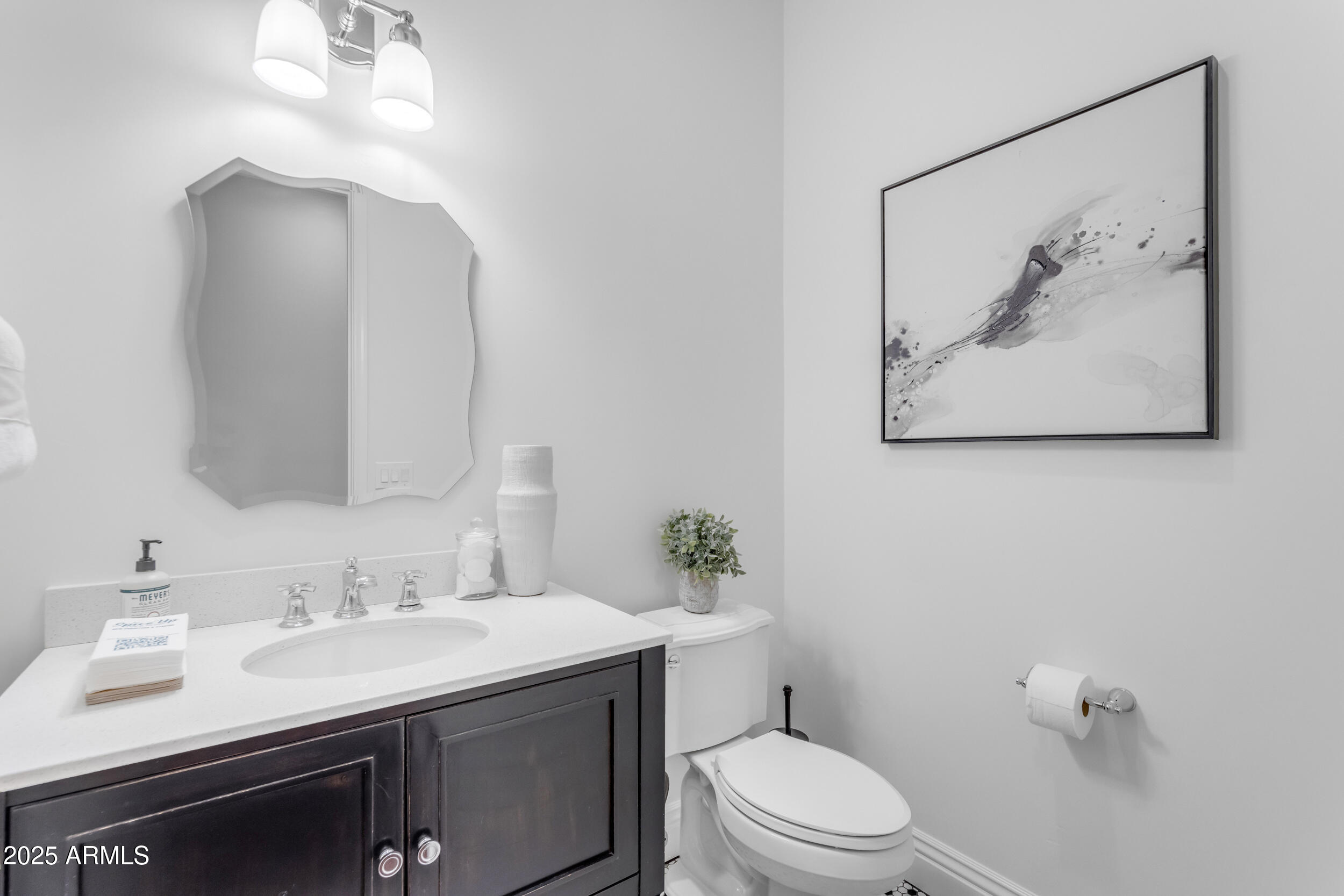 2820 Page Court Gilbert, AZ 85234 - Photo 54 of 109 a bathroom with a sink vanity mirror and toilet