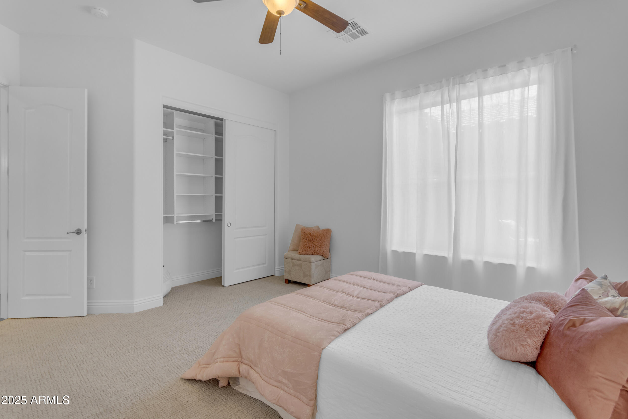 2820 Page Court Gilbert, AZ 85234 - Photo 56 of 109 a bedroom with a bed and a chandelier