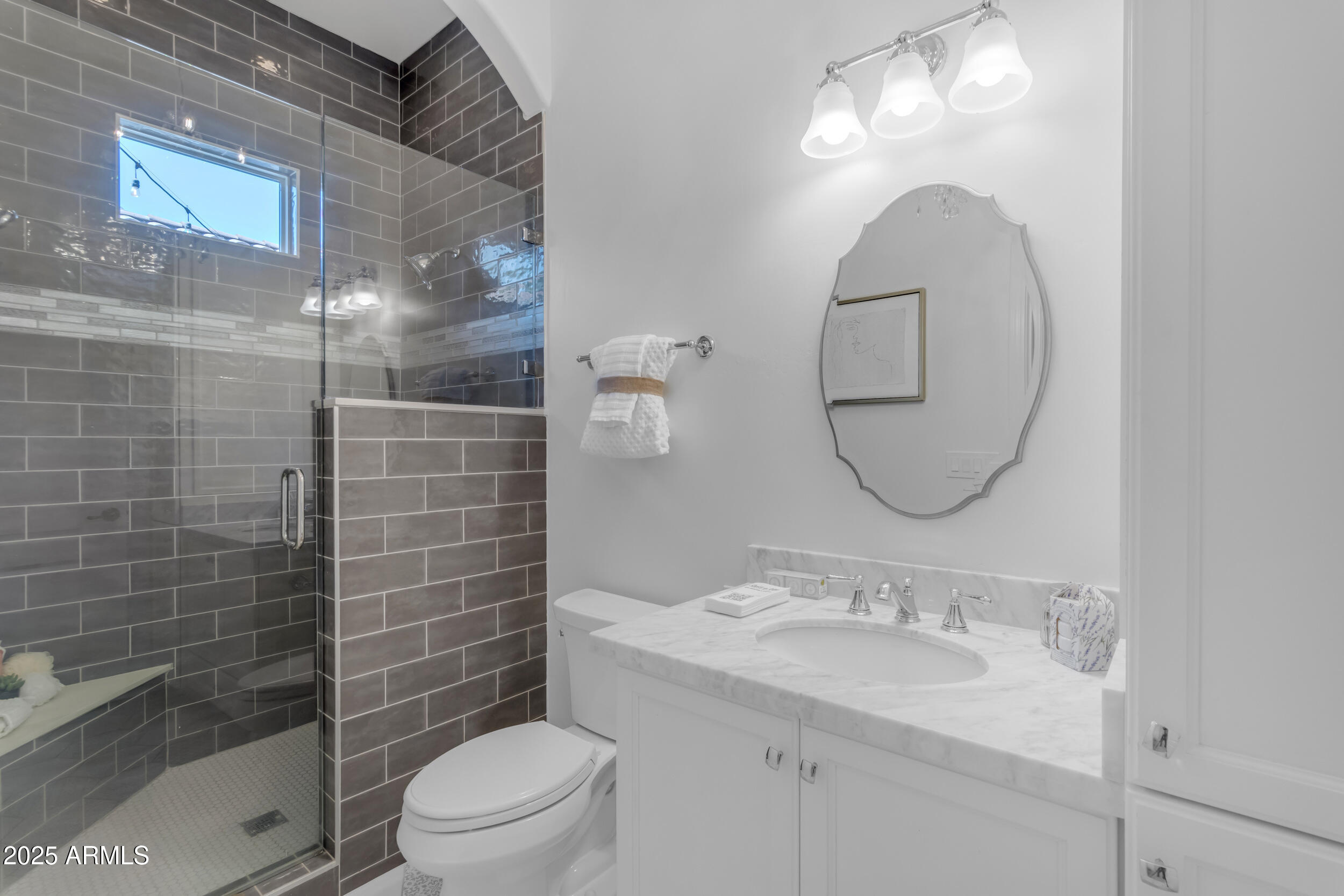 2820 Page Court Gilbert, AZ 85234 - Photo 57 of 109 a bathroom with a sink a toilet and shower