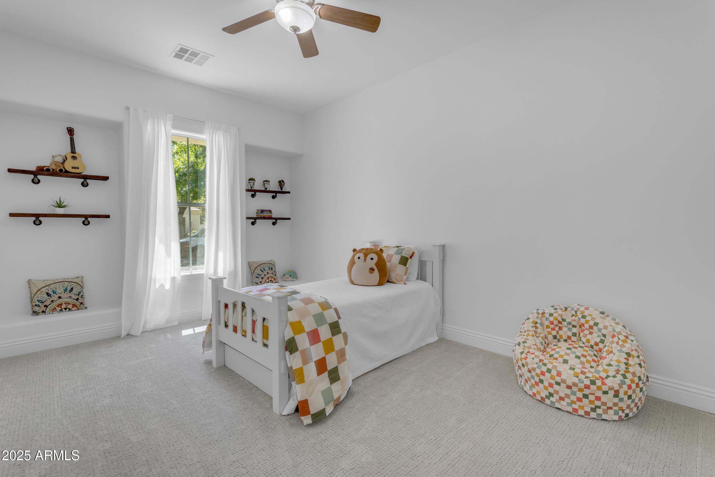 2820 Page Court Gilbert, AZ 85234 - Photo 59 of 109 a bedroom with a bed and a chandelier