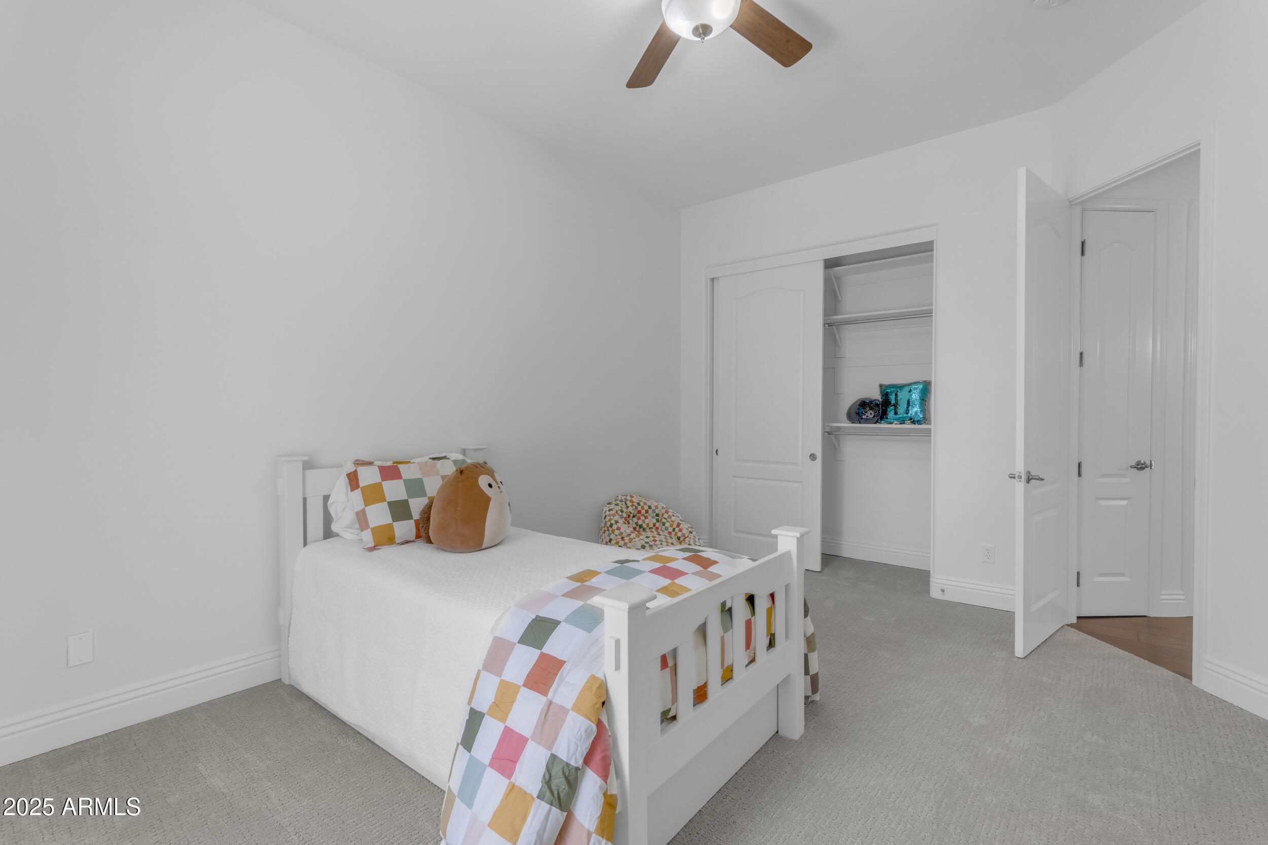 2820 Page Court Gilbert, AZ 85234 - Photo 60 of 109 a bedroom with a bed and a chandelier