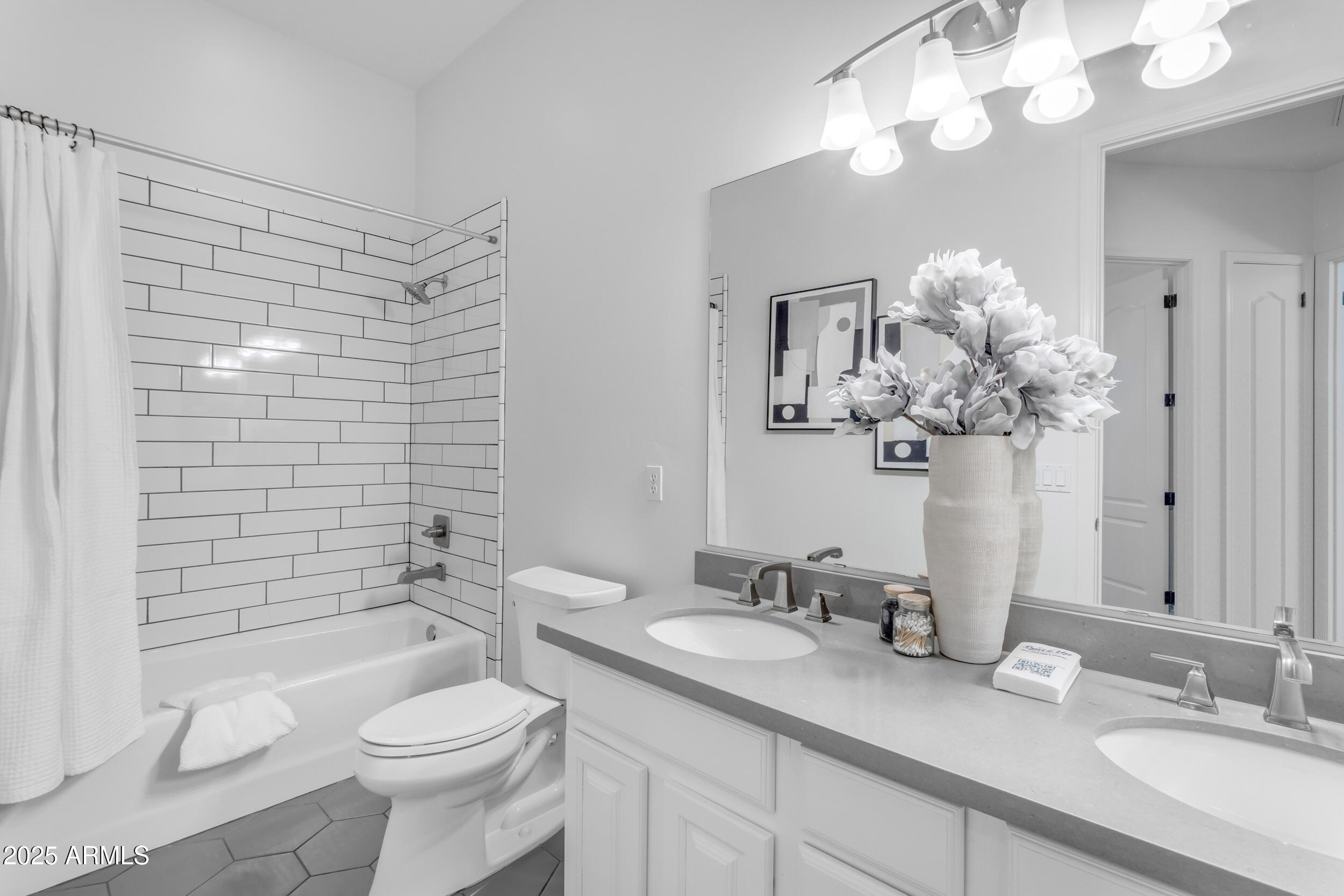2820 Page Court Gilbert, AZ 85234 - Photo 63 of 109 a bathroom with a granite countertop sink a toilet and a mirror