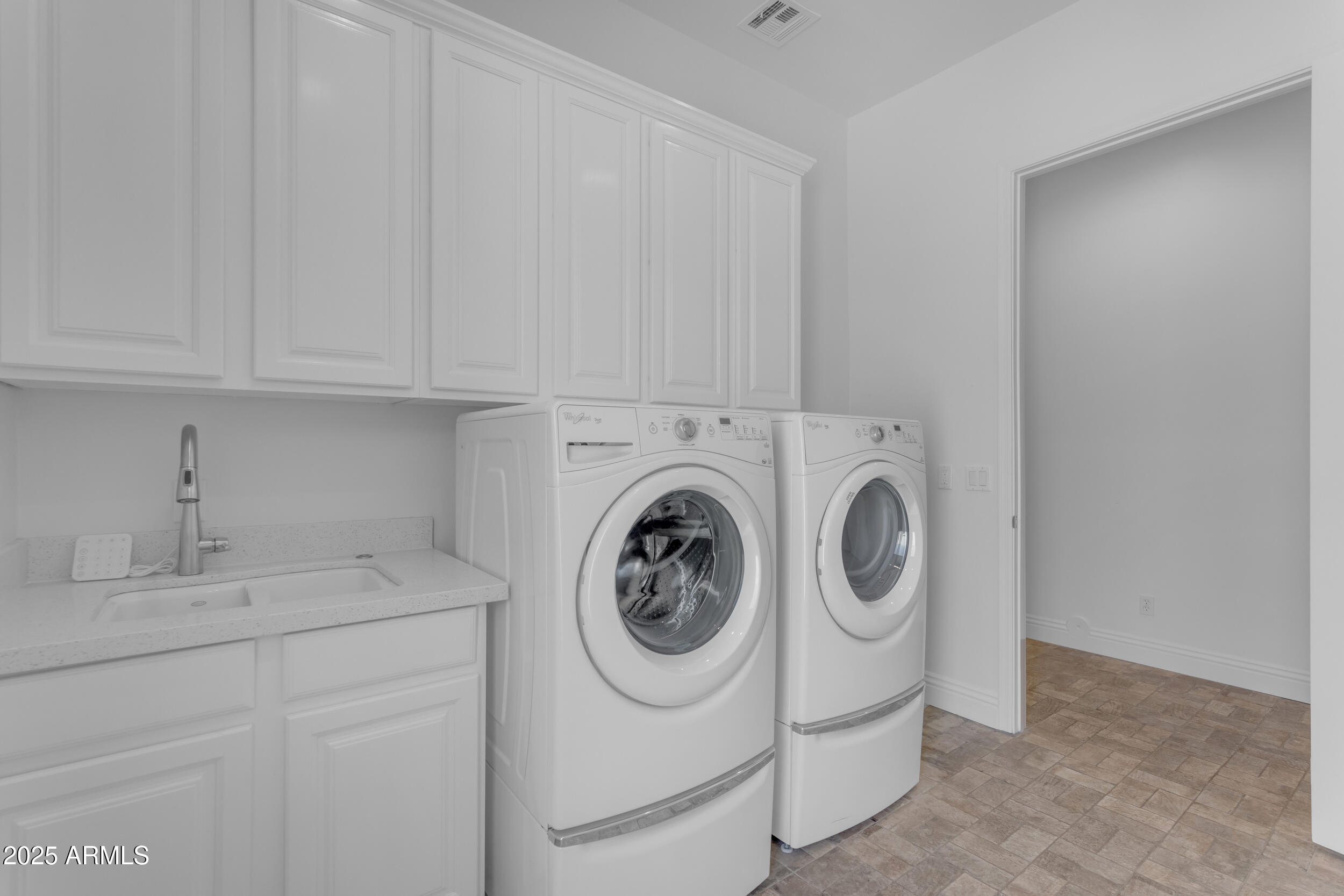 2820 Page Court Gilbert, AZ 85234 - Photo 65 of 109 a utility room with dryer and washer