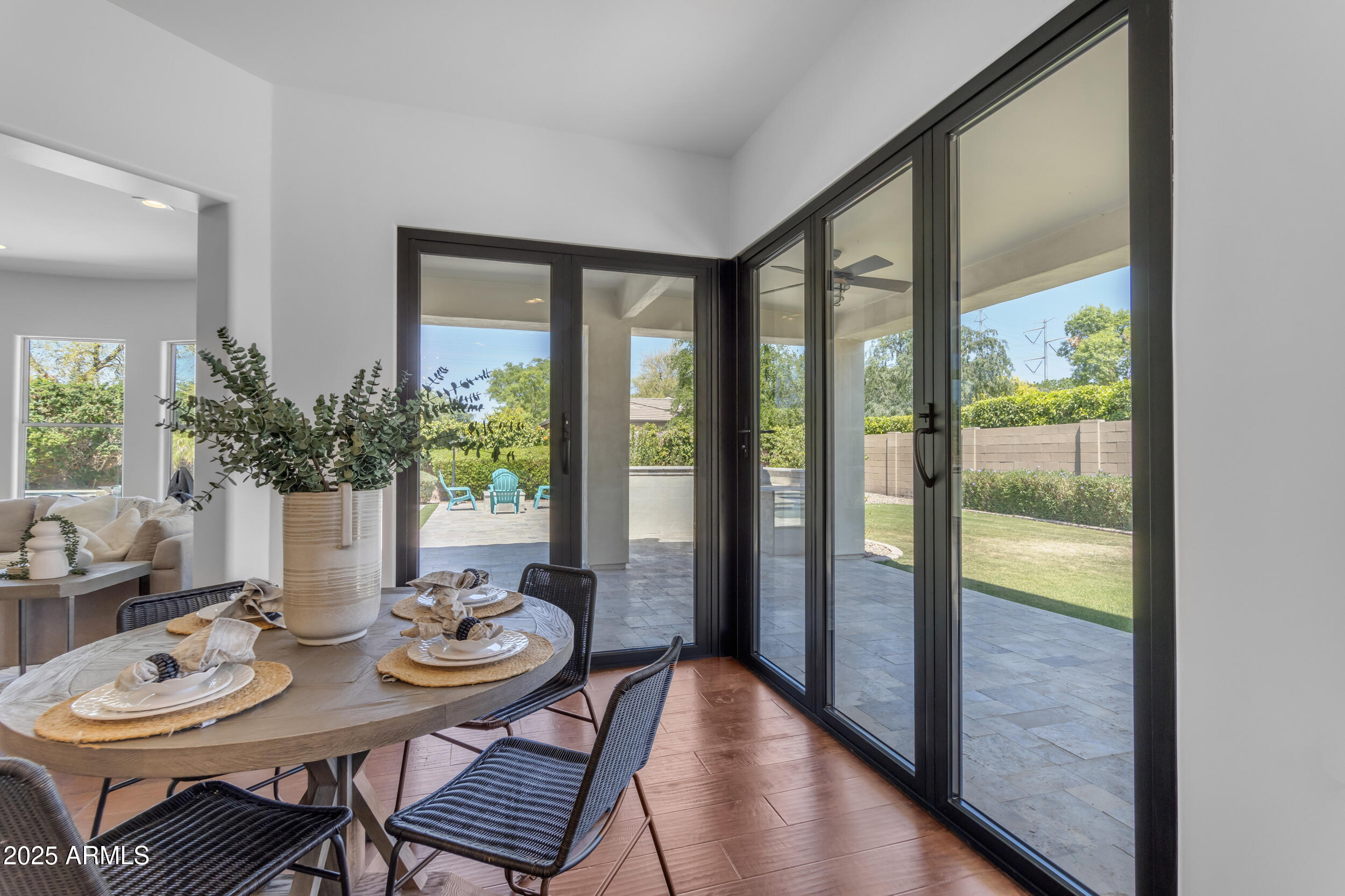 2820 Page Court Gilbert, AZ 85234 - Photo 66 of 109 a view of a dining room with furniture window and wooden floor