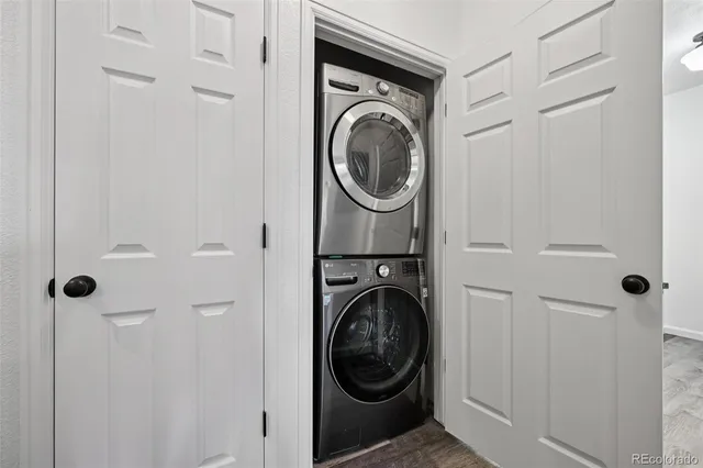 a utility room with sink dryer and washer