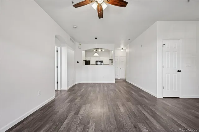 a view of a kitchen with a dishwasher cabinets and wooden floor