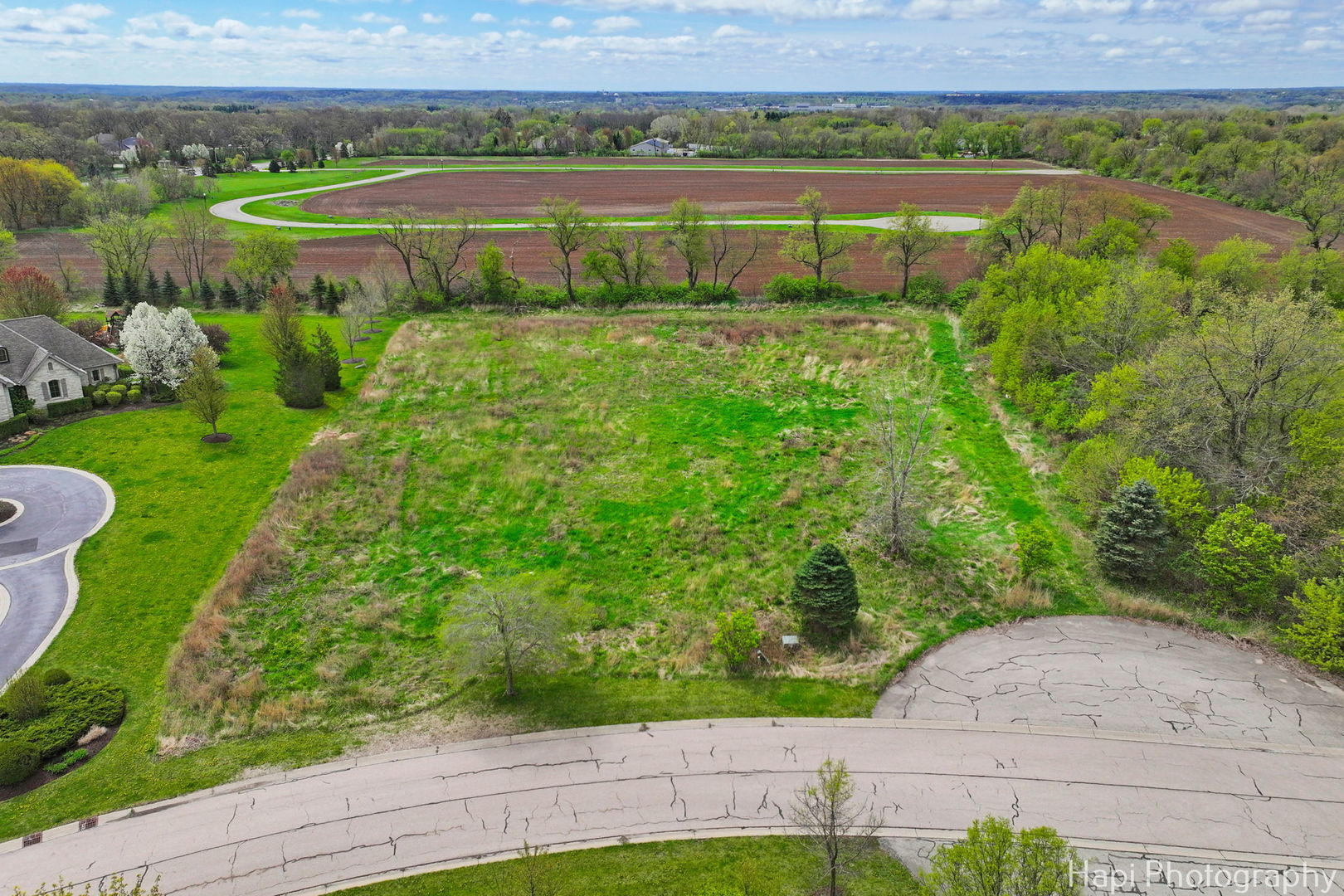 2647 Sanctuary Lane Spring Grove, IL 60081 - Photo 1 of 11 a view of a lake with a outdoor space