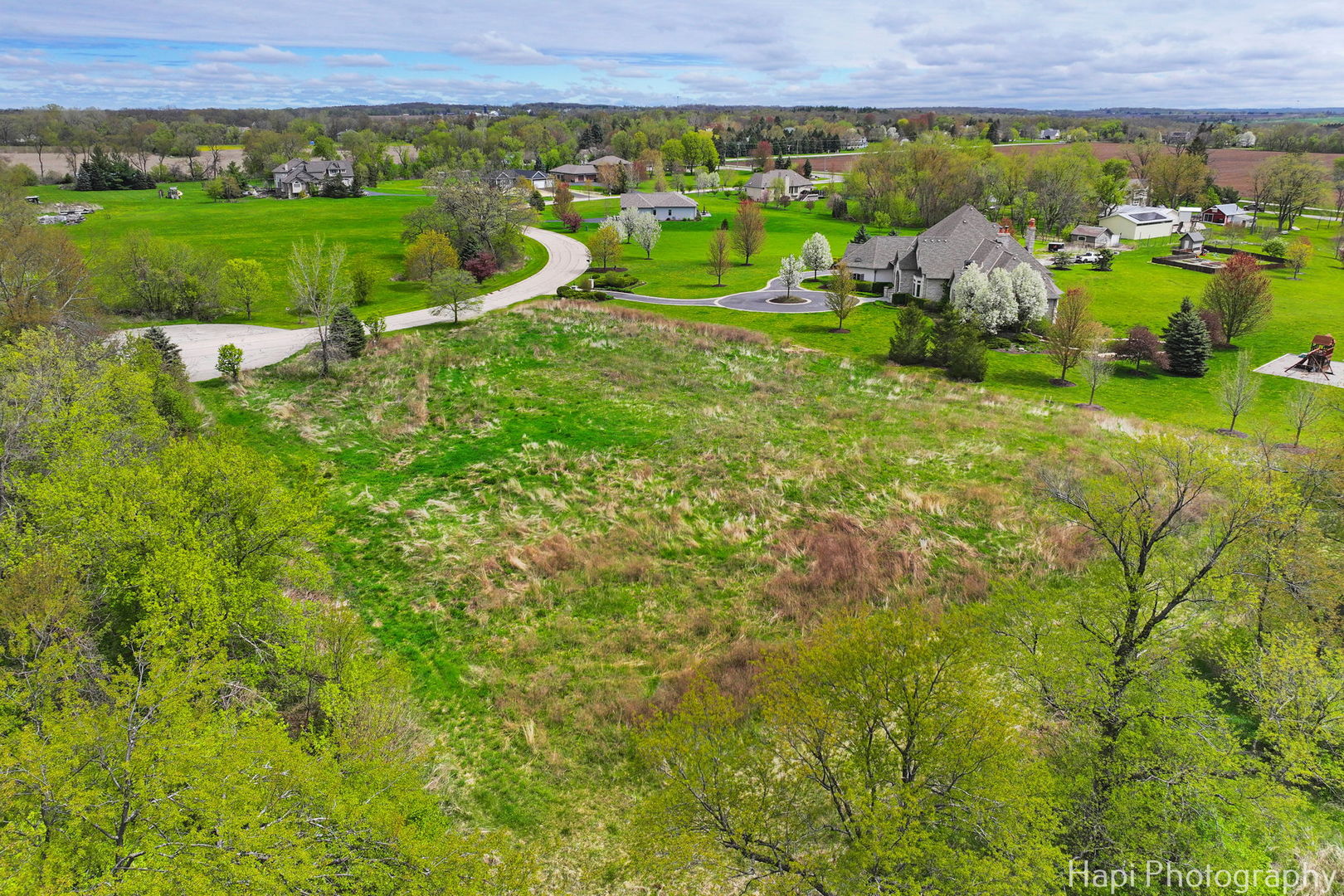 2647 Sanctuary Lane Spring Grove, IL 60081 - Photo 7 of 11 a view of a lush green field