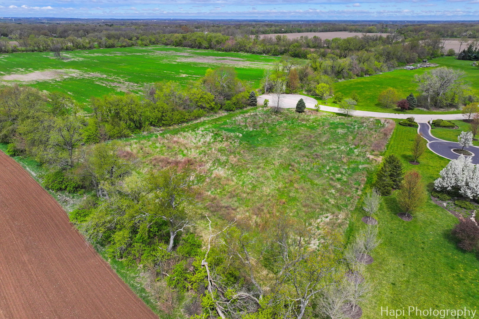 2647 Sanctuary Lane Spring Grove, IL 60081 - Photo 10 of 11 a view of a lush green outdoor space with a lake view