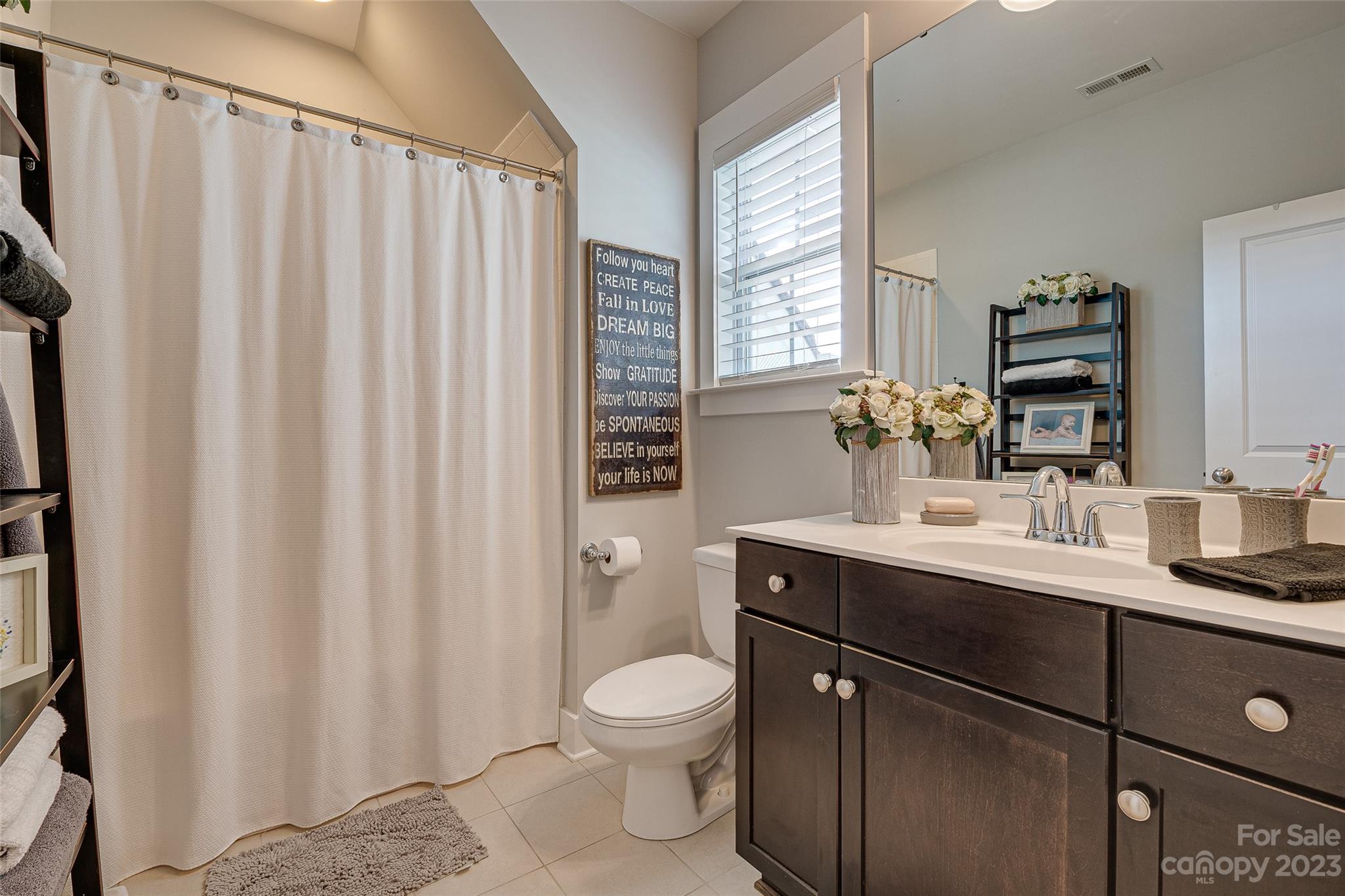 664 Bluff Loop Road Rock Hill, SC 29730 - Photo 16 of 26 a bathroom with a toilet a sink and mirror