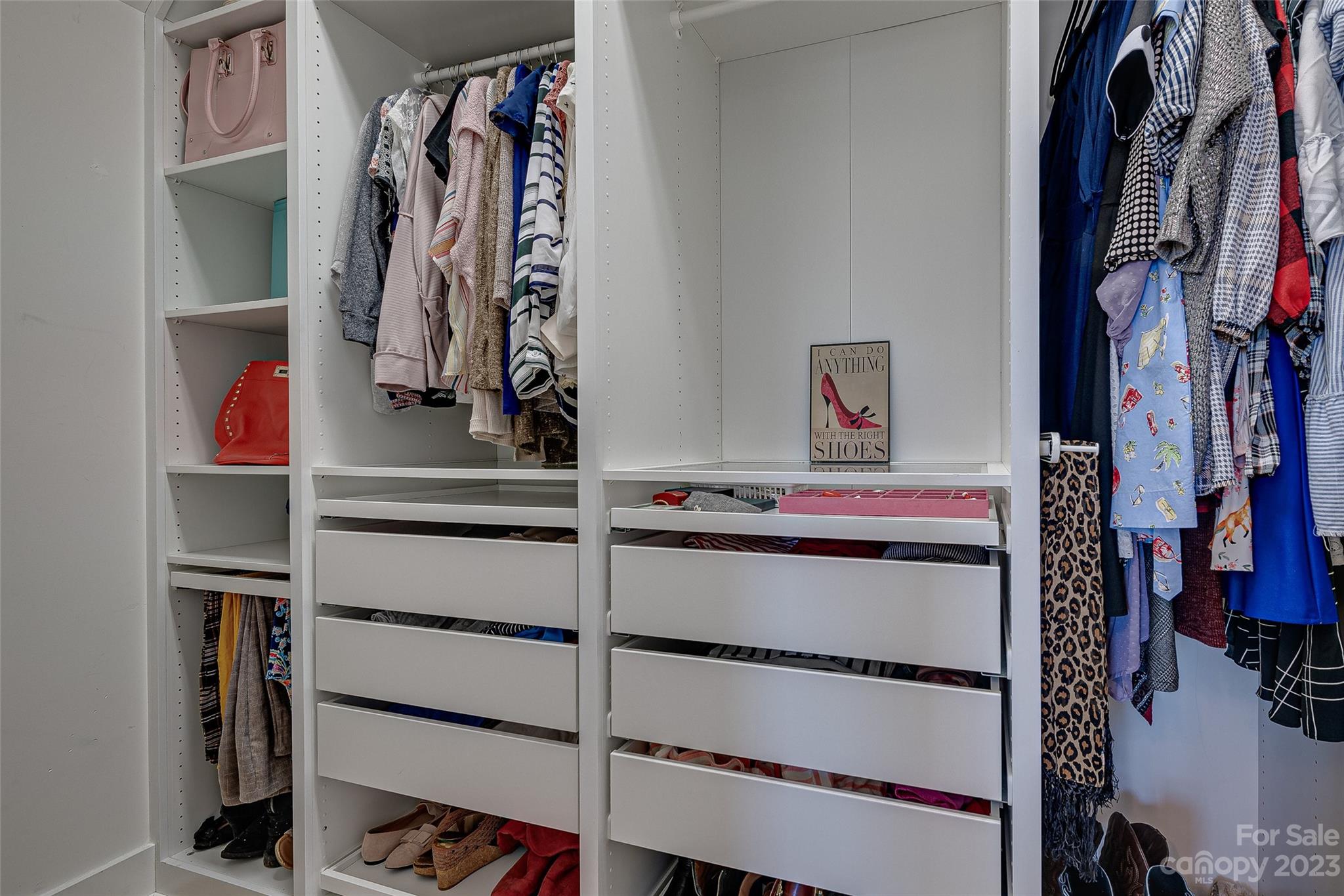 664 Bluff Loop Road Rock Hill, SC 29730 - Photo 20 of 26 a view of walk in closet with clothes and shoes