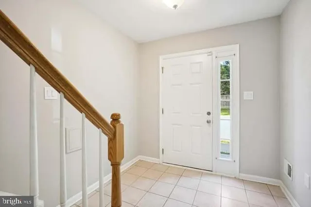 a view of an entryway with staircase