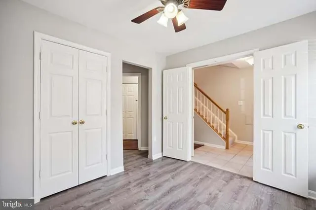 an entryway with a hardwood floor