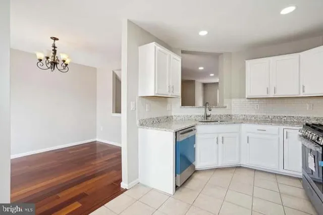 a kitchen with a sink cabinets and window