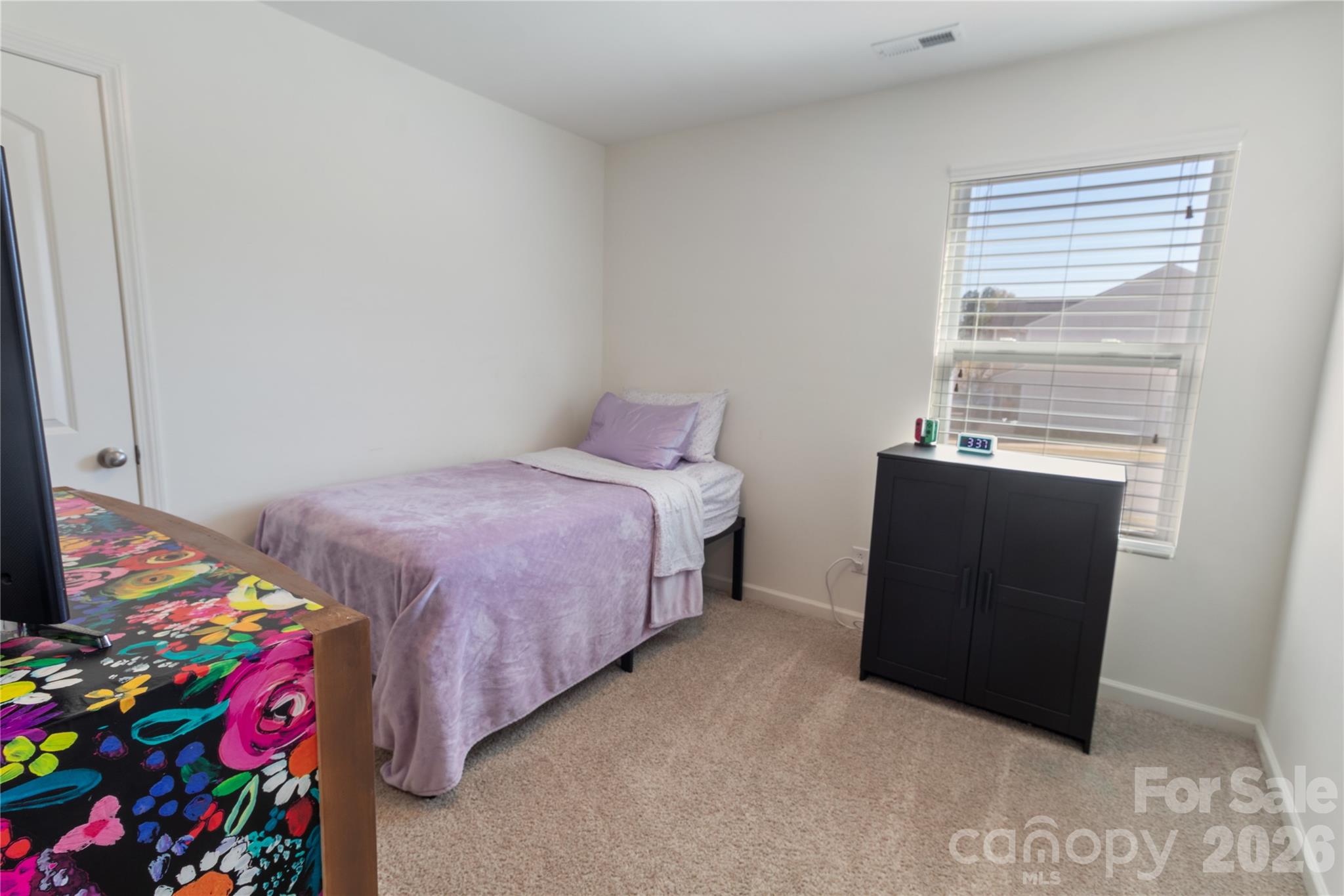 905 Alta Way Kannapolis, NC 28081 - Photo 15 of 24 a bedroom with a bed and a window