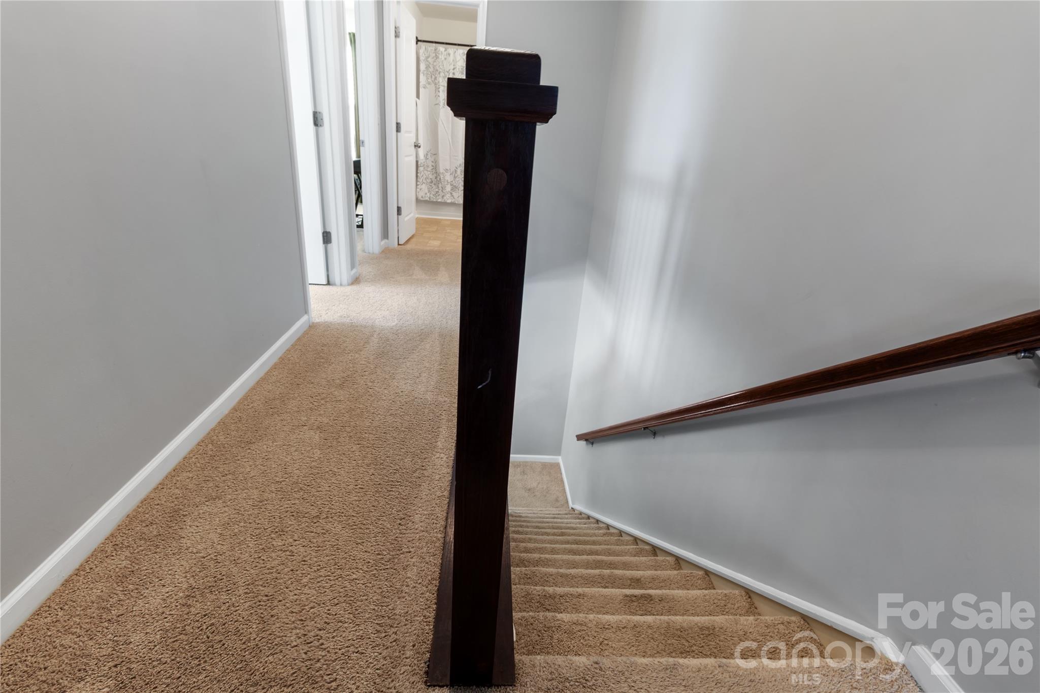 905 Alta Way Kannapolis, NC 28081 - Photo 16 of 24 a view of a hallway with wooden floor and staircase