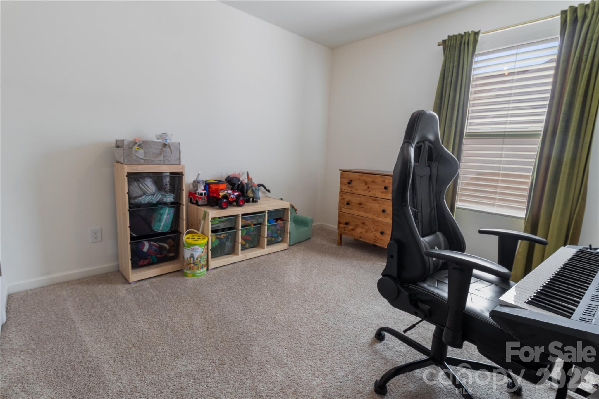 905 Alta Way Kannapolis, NC 28081 - Photo 19 of 24 a view of a bedroom with workspace and windows