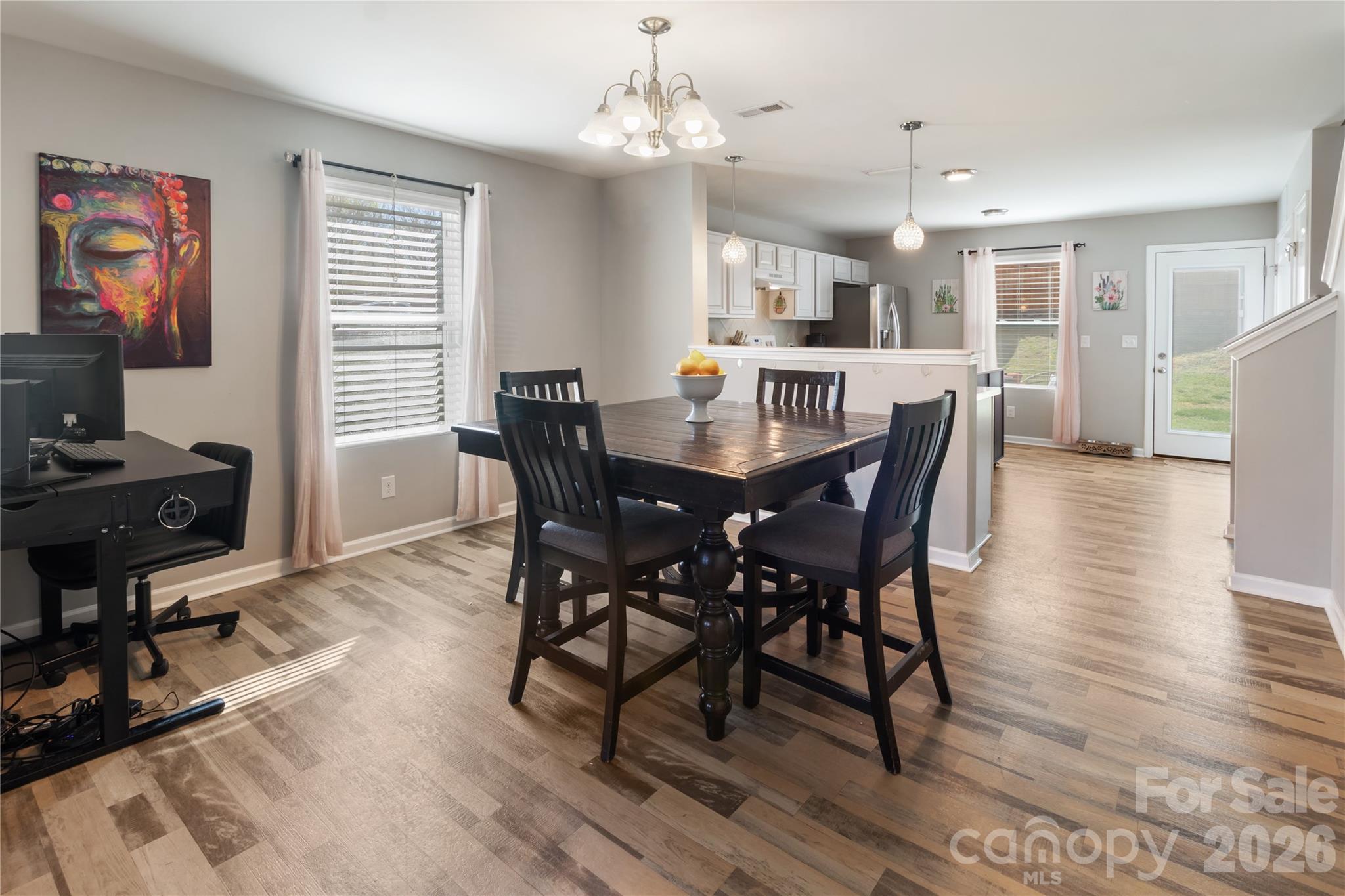 905 Alta Way Kannapolis, NC 28081 - Photo 6 of 24 a view of a dining room with furniture window and wooden floor