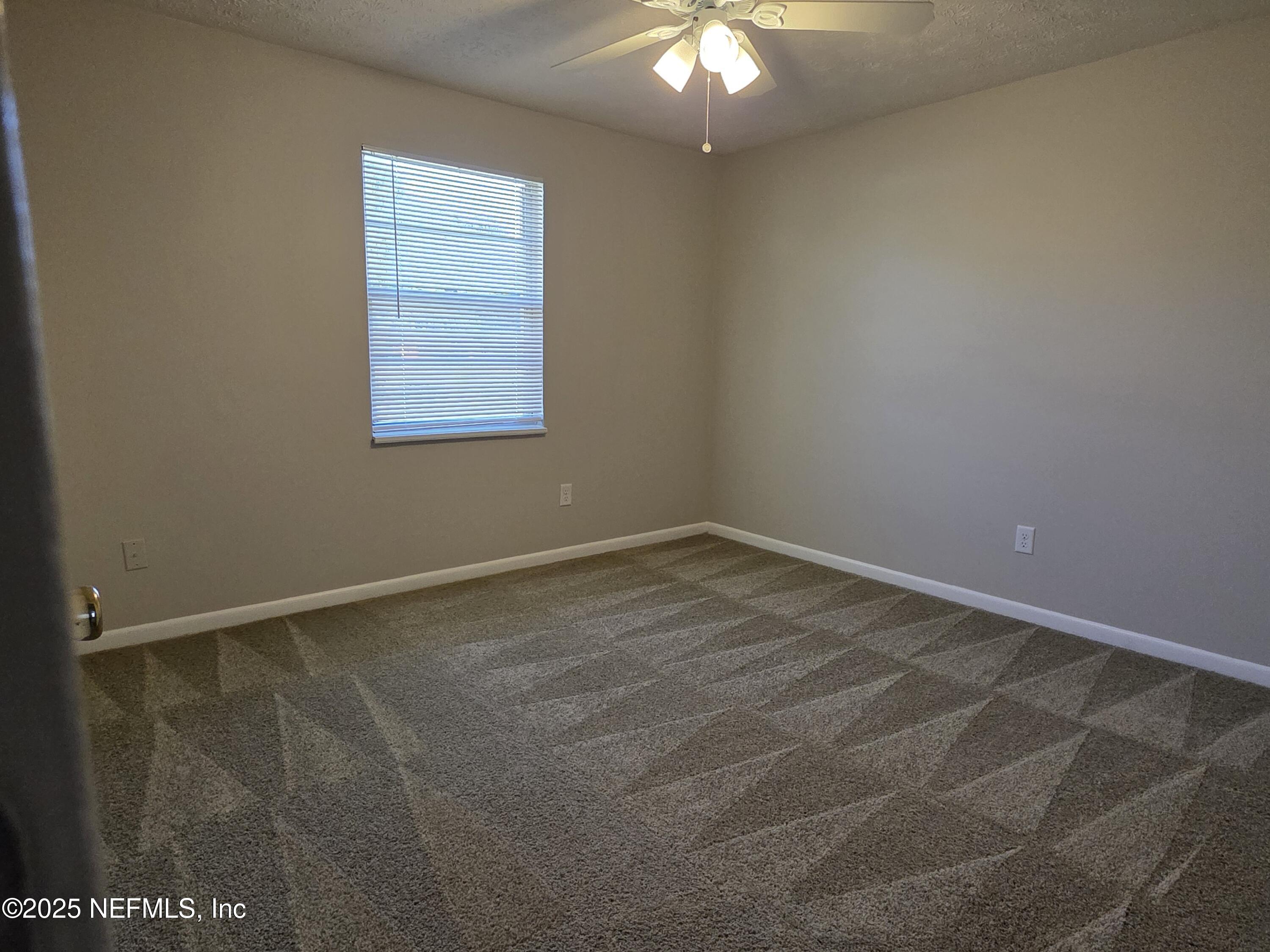 1143 Tumbleweed Drive Orange Park, FL 32065 - Photo 11 of 15 an empty room with a window