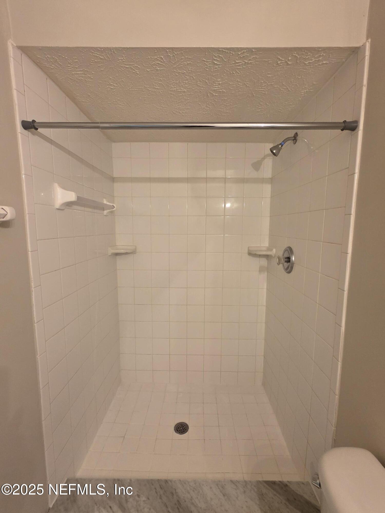 1143 Tumbleweed Drive Orange Park, FL 32065 - Photo 14 of 15 a bathroom with a shower