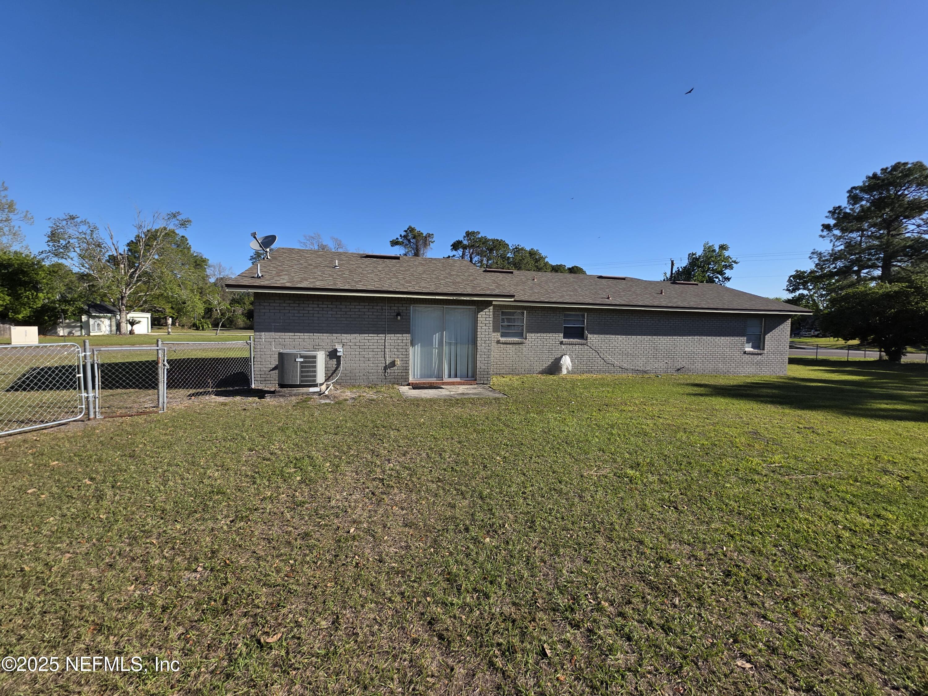 1143 Tumbleweed Drive Orange Park, FL 32065 - Photo 15 of 15 a front view of a house with a garden