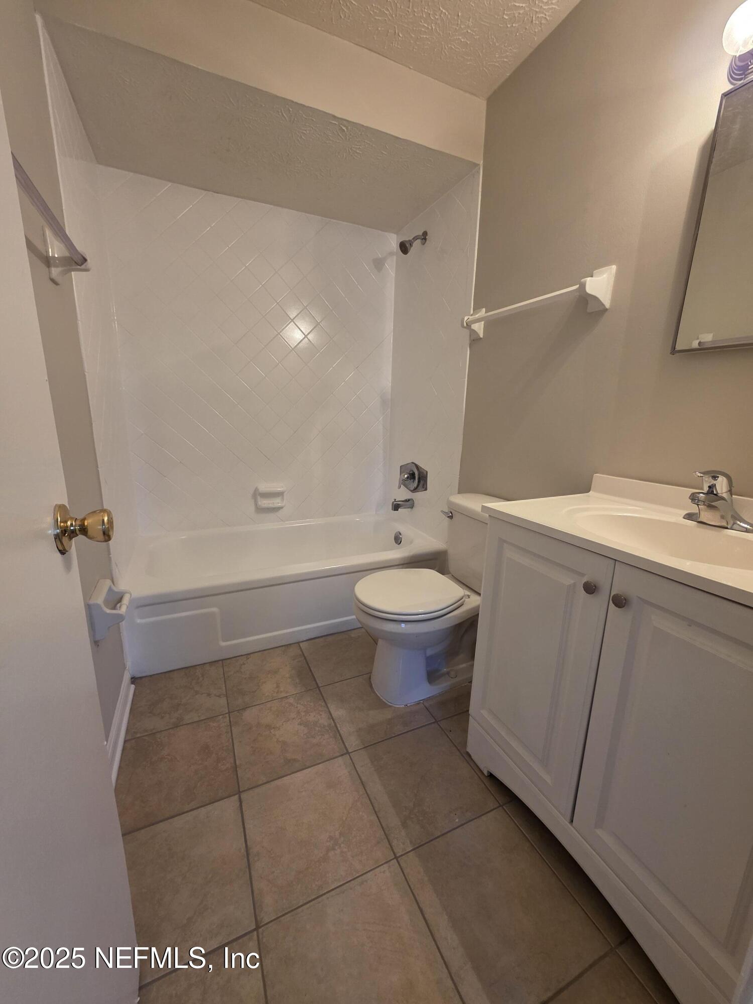1143 Tumbleweed Drive Orange Park, FL 32065 - Photo 10 of 15 a bathroom with a sink a toilet and shower