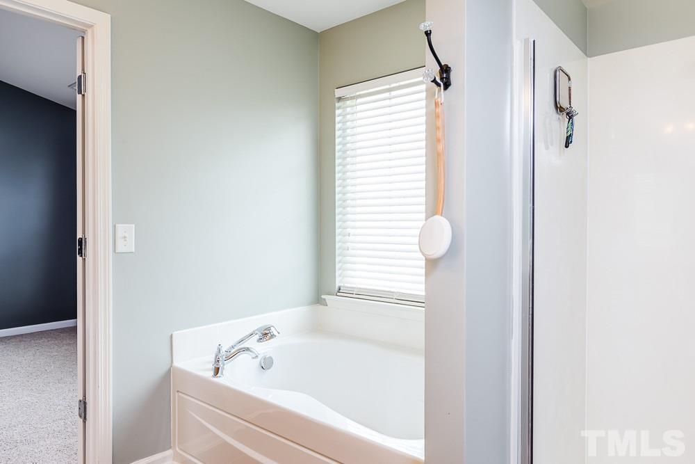 8225 Pilots View Drive Raleigh, NC 27617 - Photo 12 of 20 Deep soaker garden tub, a separate shower, and a water closet!