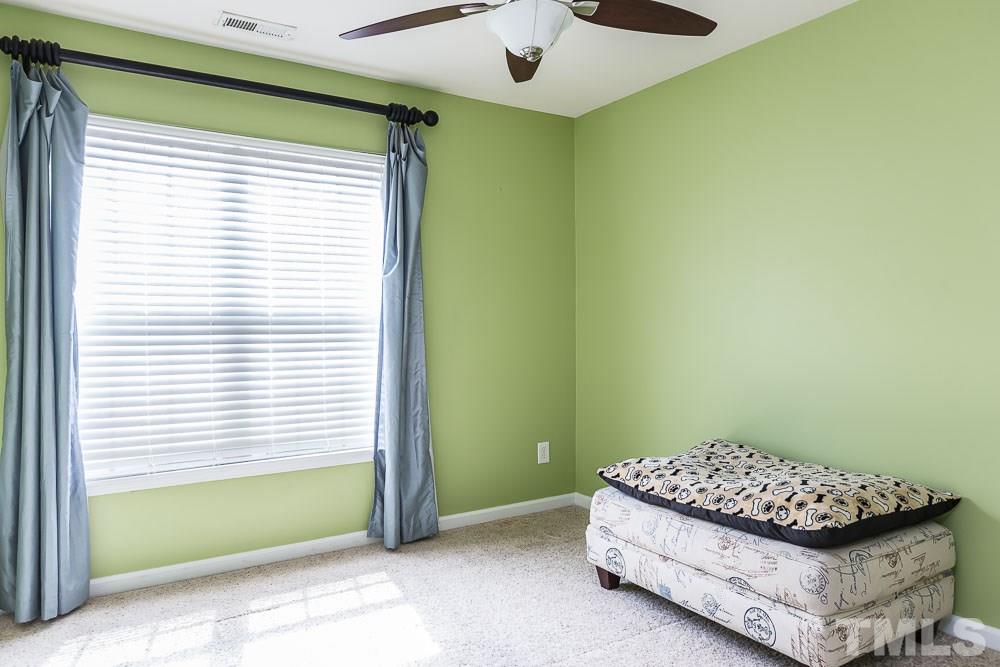 8225 Pilots View Drive Raleigh, NC 27617 - Photo 14 of 20 Current owners sold the queen bed, but it fit well in this sunny room!