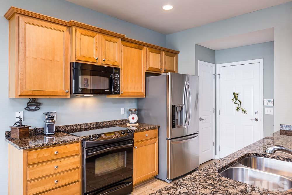 8225 Pilots View Drive Raleigh, NC 27617 - Photo 6 of 20 Granite counters, upgraded range, and pantry! Stainless refrigerator conveys!
