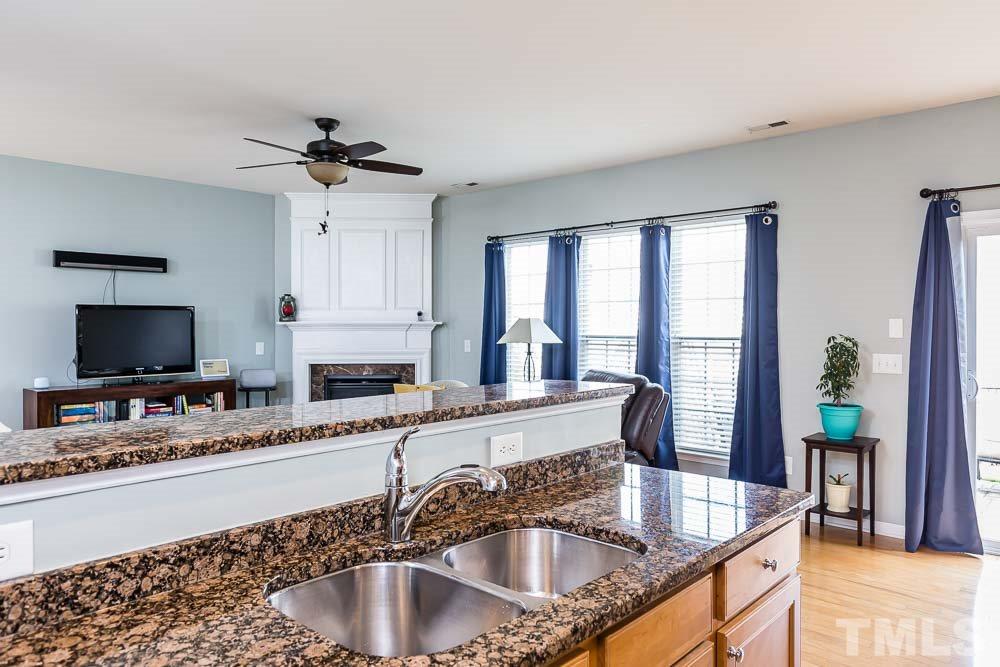 8225 Pilots View Drive Raleigh, NC 27617 - Photo 7 of 20 Sliders bathe the dining area with natural light and invite guests to the gorgeous custom patio!