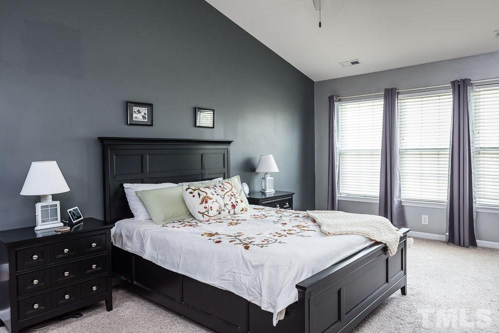 8225 Pilots View Drive Raleigh, NC 27617 - Photo 9 of 20 Soaring cathedral ceilings and generous windows open this dramatic, large master bedroom!