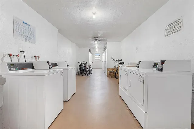 a view of swimming pool with outdoor seating and a garden