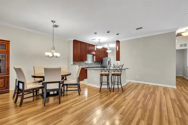 a view of kitchen with furniture and wooden floor