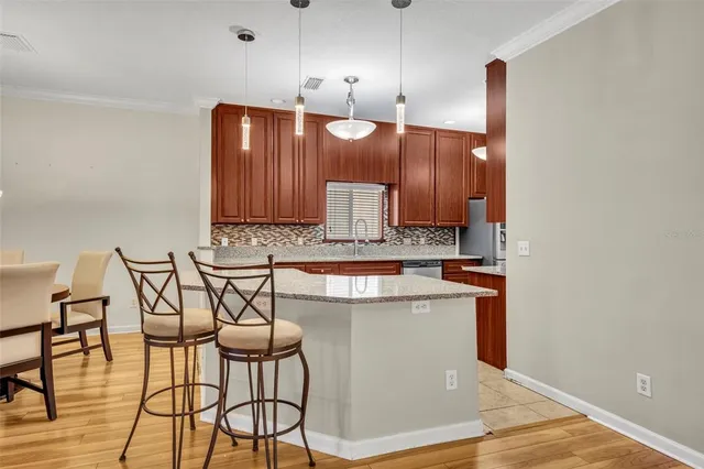 a open kitchen with a table and chairs