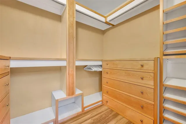 a spacious bathroom with a sink a mirror and a shower