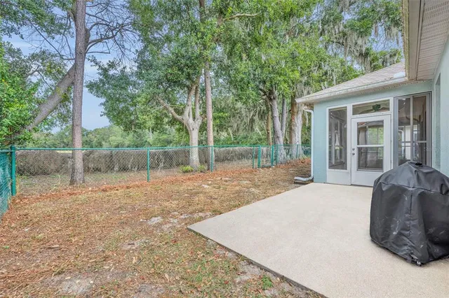 an aerial view of a house with yard swimming pool and outdoor seating