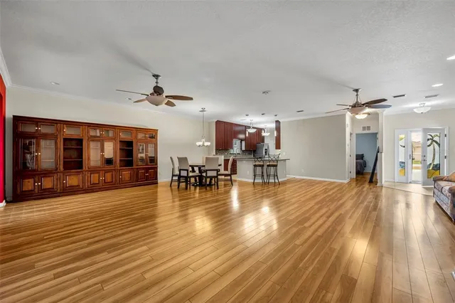 a view of a living room and kitchen with furniture and fireplace